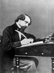 19th century freelance writer at desk with quill pen.